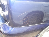 自動車保険を使った修理の修理事例：右クォータ凹み傷